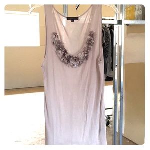 Sleeveless beige shirt with embellishments